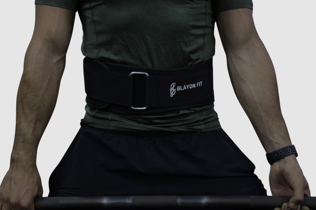 man using power lifting belt to left in squats and deadlifts