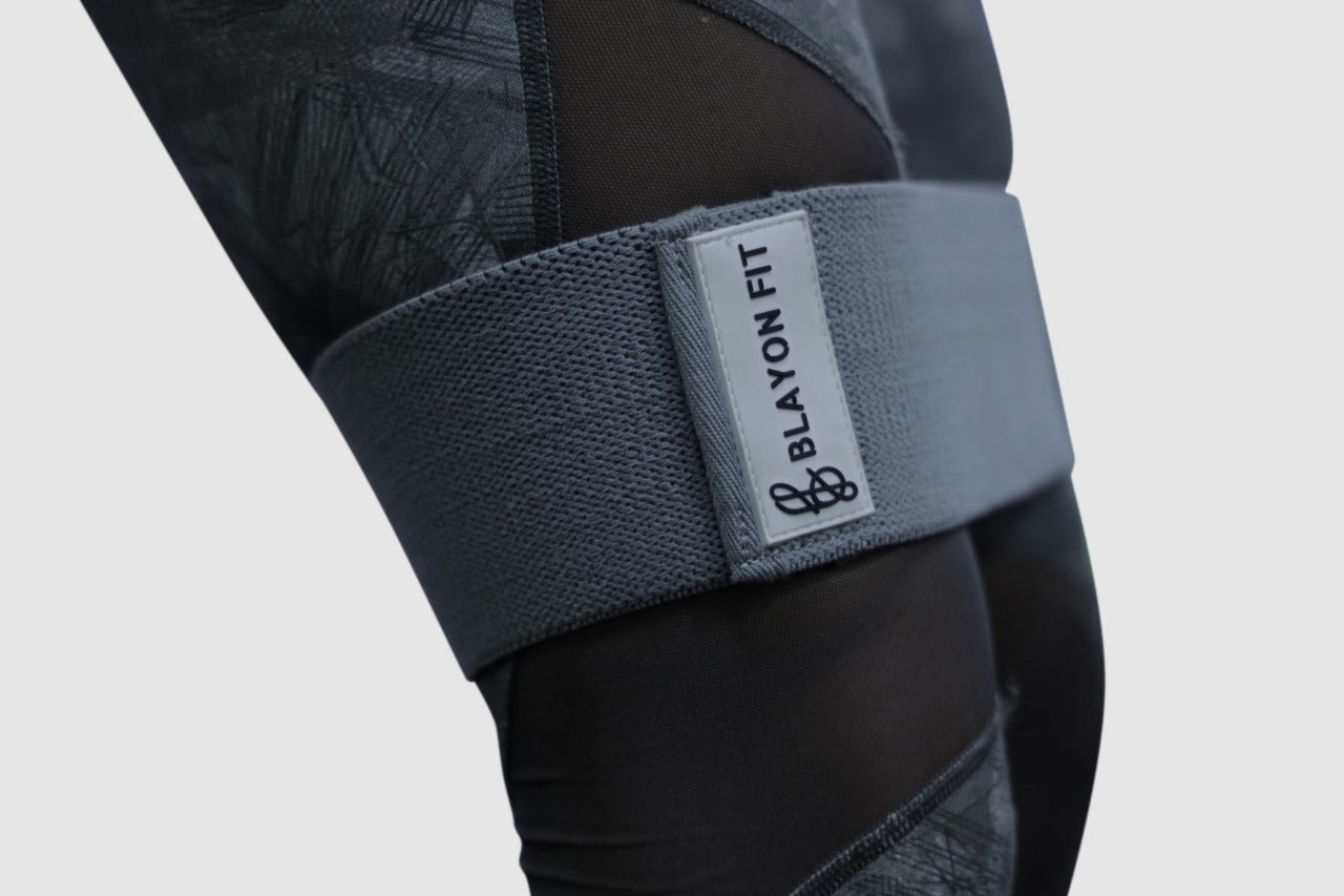 woman using fabric resistant bands for female home workout