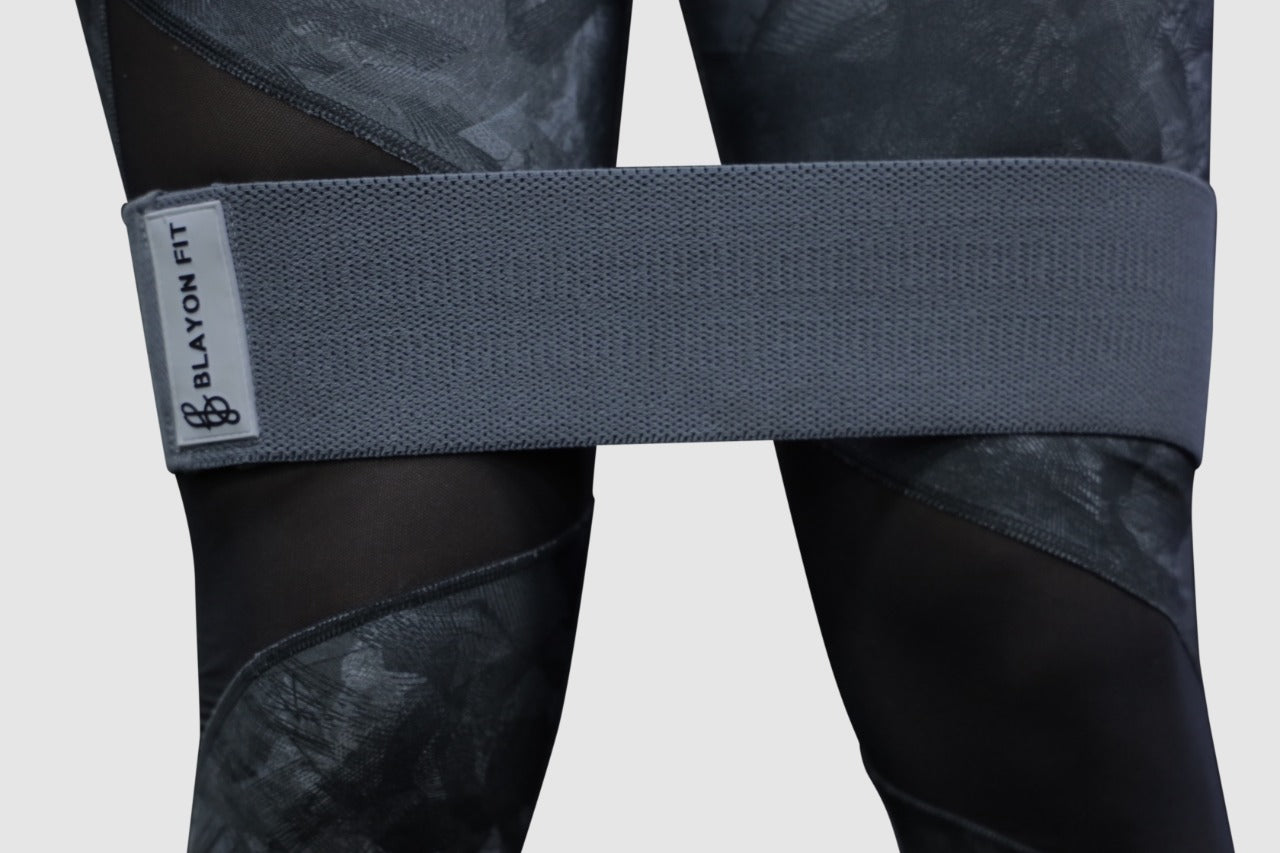 woman using fabric resistant bands for female home workout