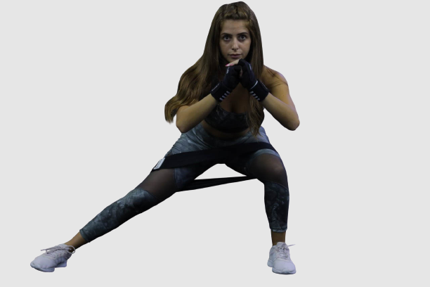 woman using black light fabric resistant bands for home workout