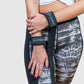 woman wearing fashionably the wrist strap before performing compound exercises. 