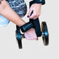 woman using the wrist strap to secure her grip while performing a dumbbell row exercise. 