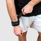 man using the weightlifting wrist strap to increase his weights on the deadlift exercise. 