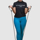 woman exercising her arms  with resistant tube and band.