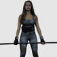 woman using power lifting belt to left in squats and deadlifts