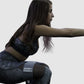 woman using fabric resistant bands for female home workout such as squats